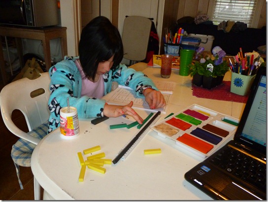 Lilly Working on Multiplication with Rods.